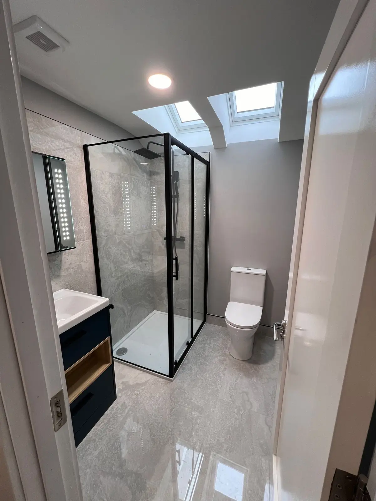 Attic shower room under rooflights