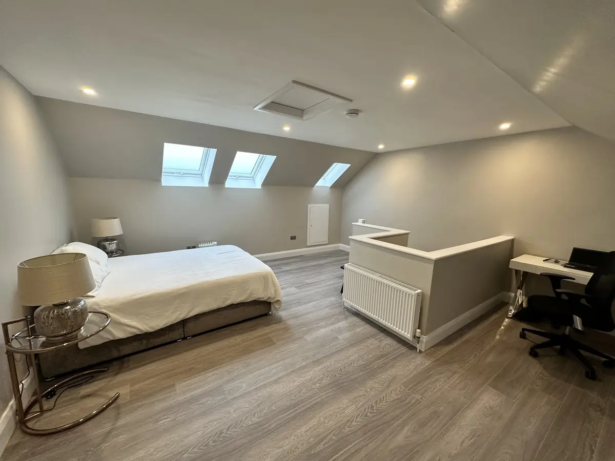 Converted attic with bedroom, study area and three rooflights