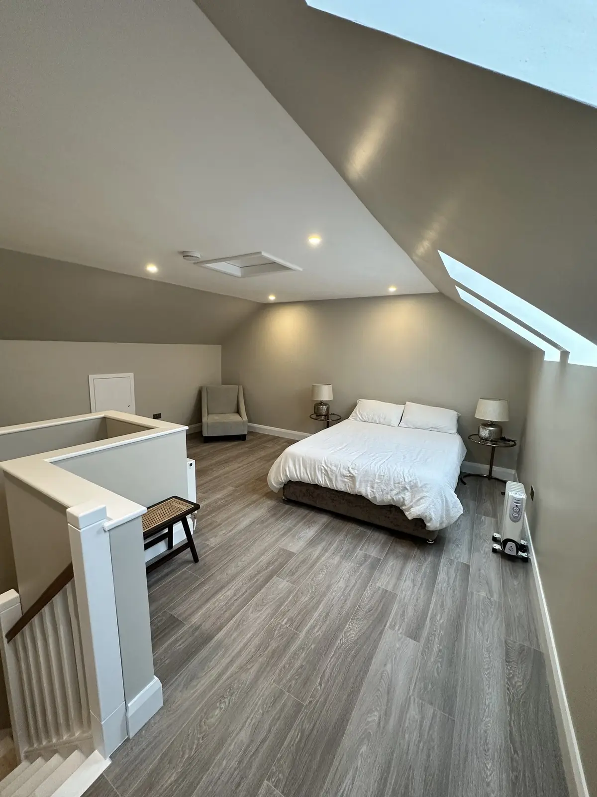 Stair balustrade, bedroom and rooflight in the roof slope