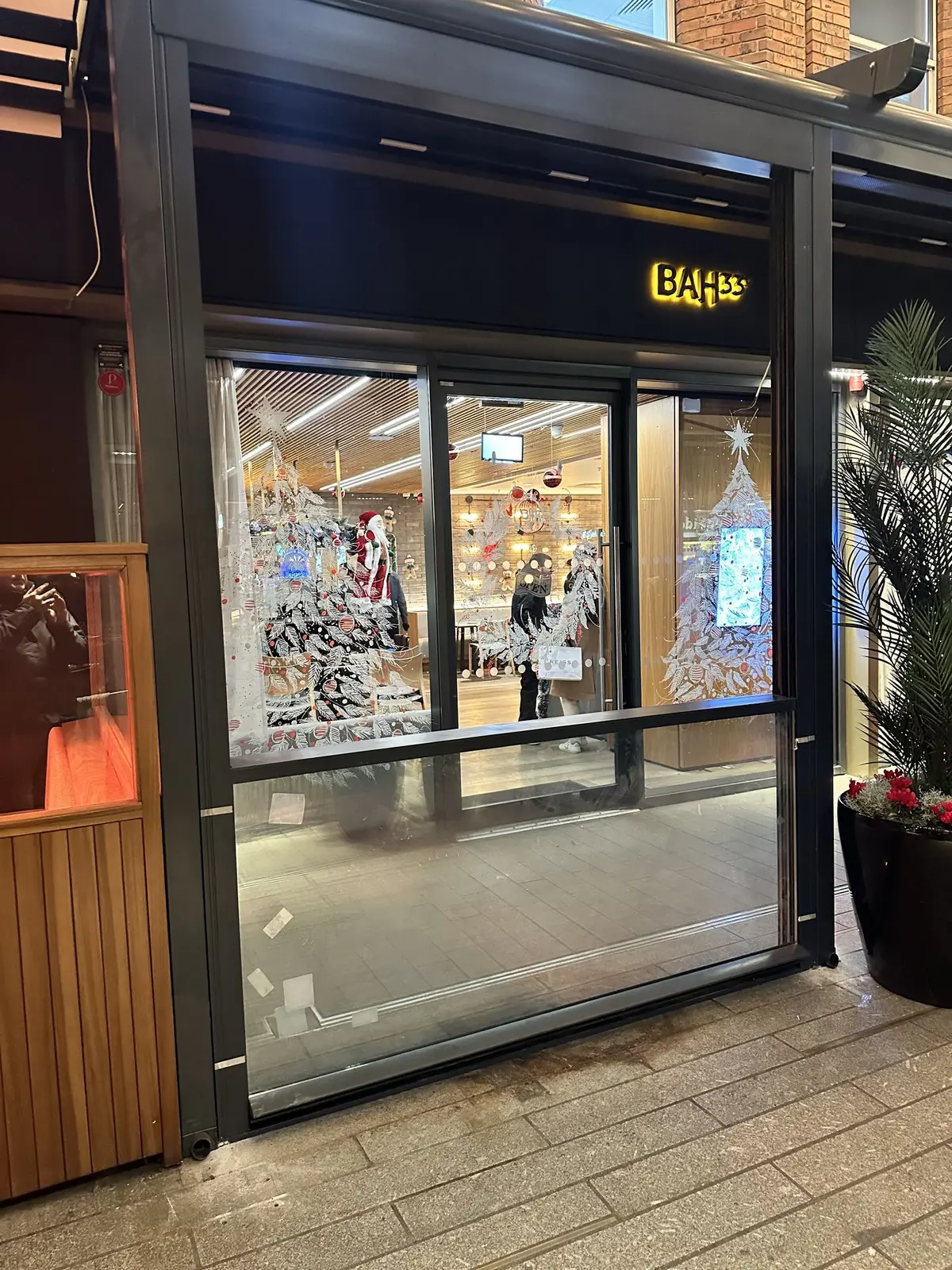 Glazed shopfront door with BAH33 sign