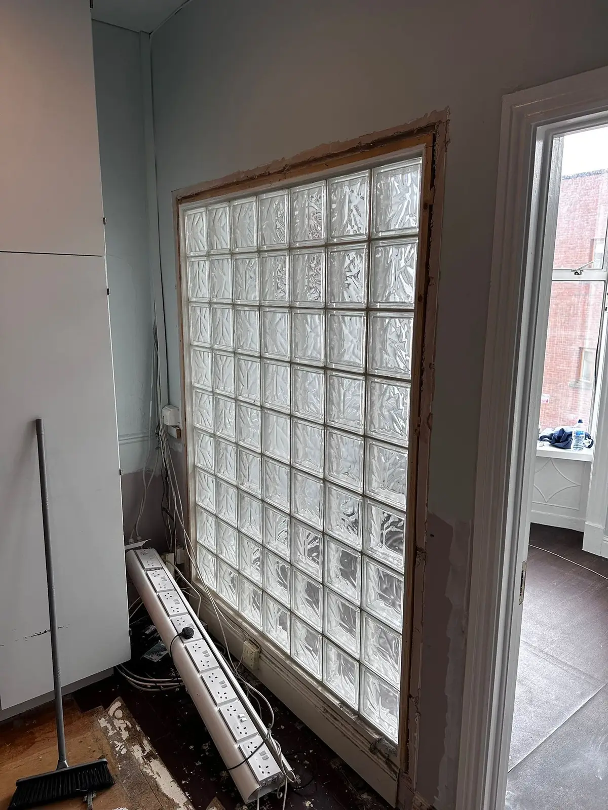 Glass block wall being enclosed