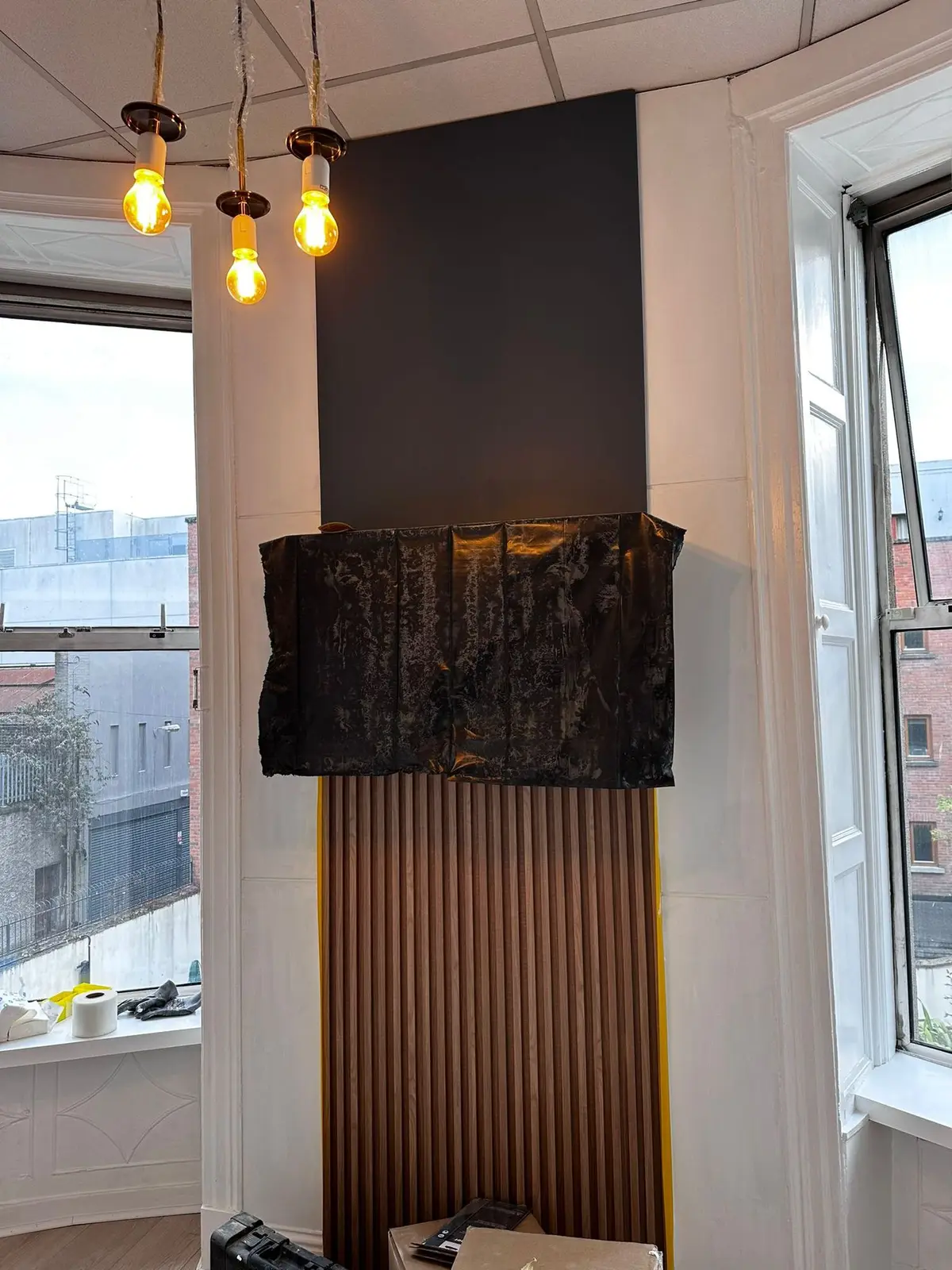 Slatted feature column with pendant lighting