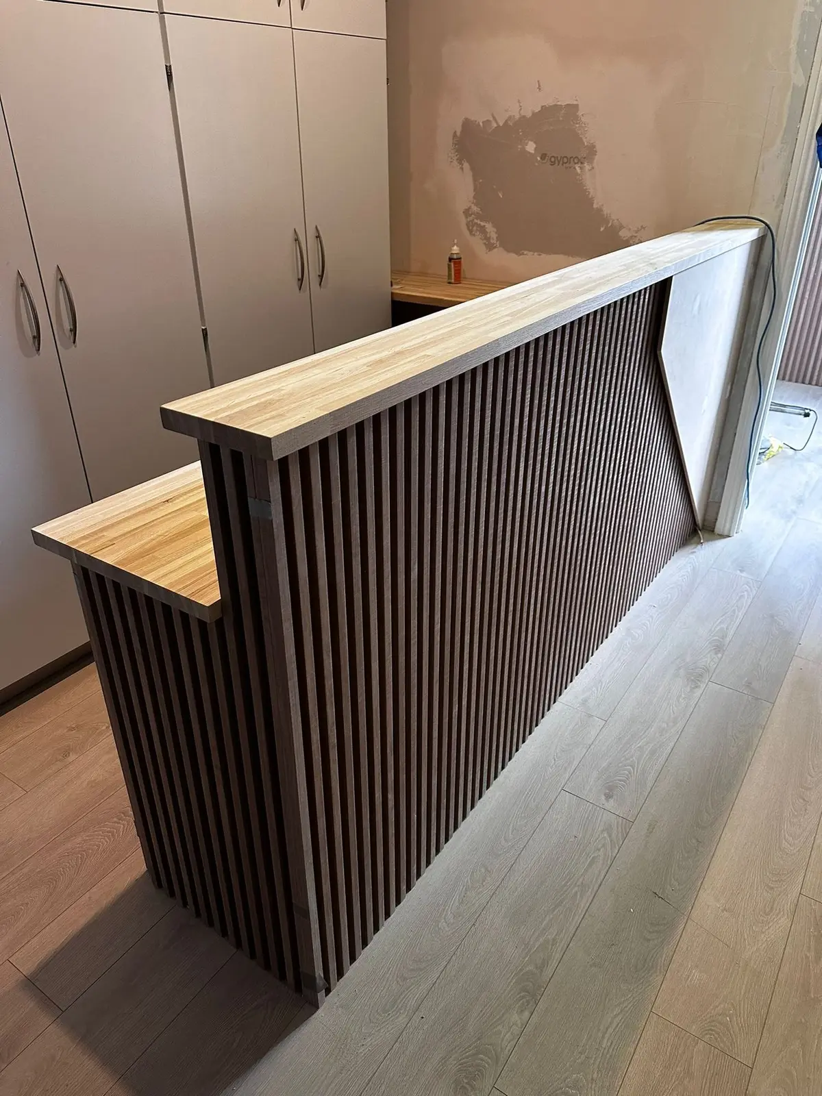 Slatted reception desk front and oak top