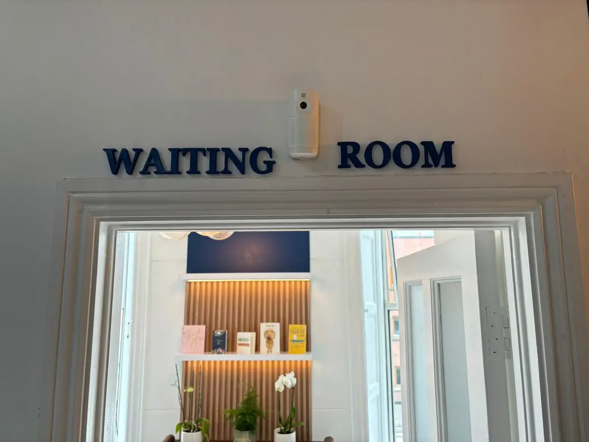 Waiting room entrance with shelving