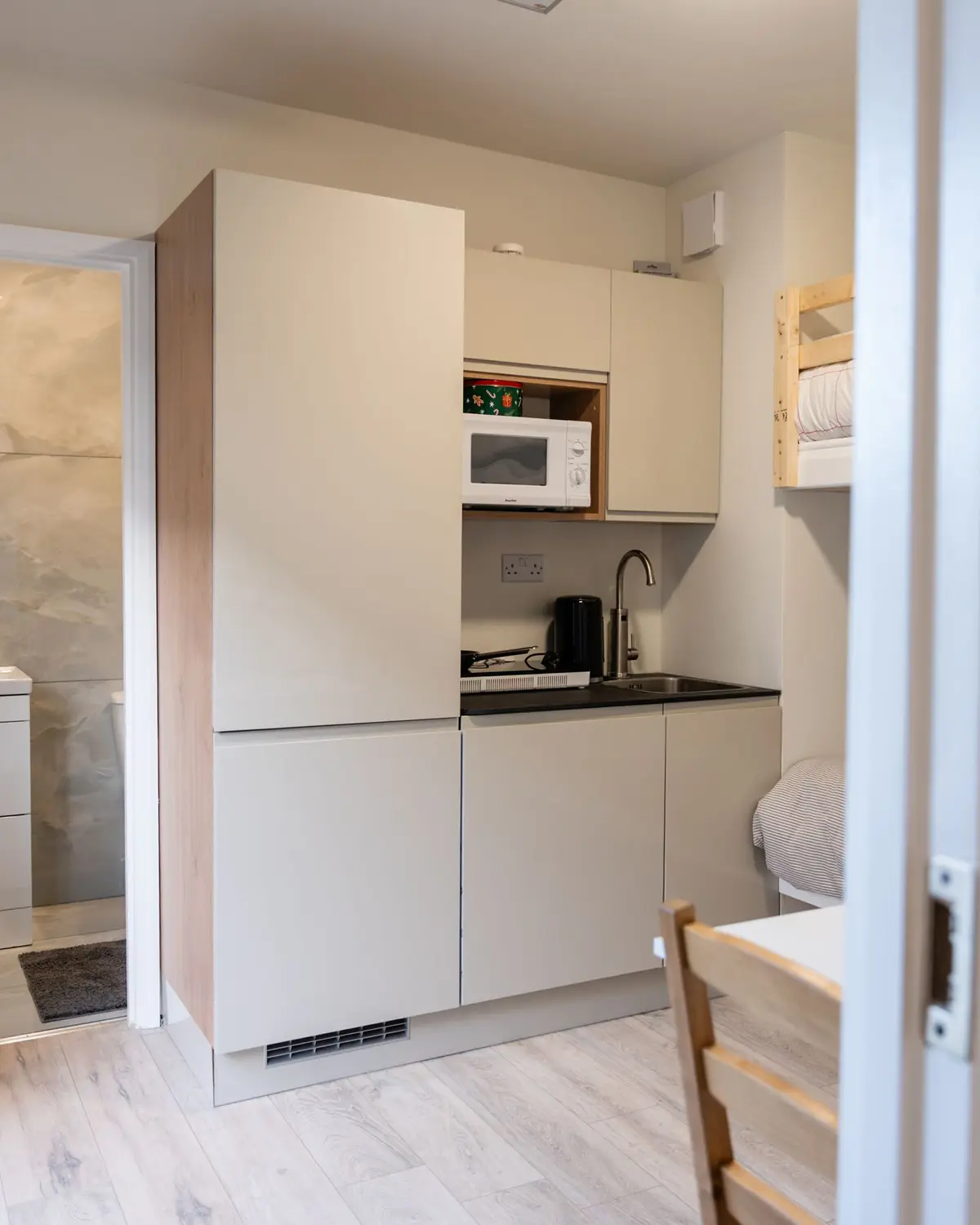 Kitchenette and shower room beyond