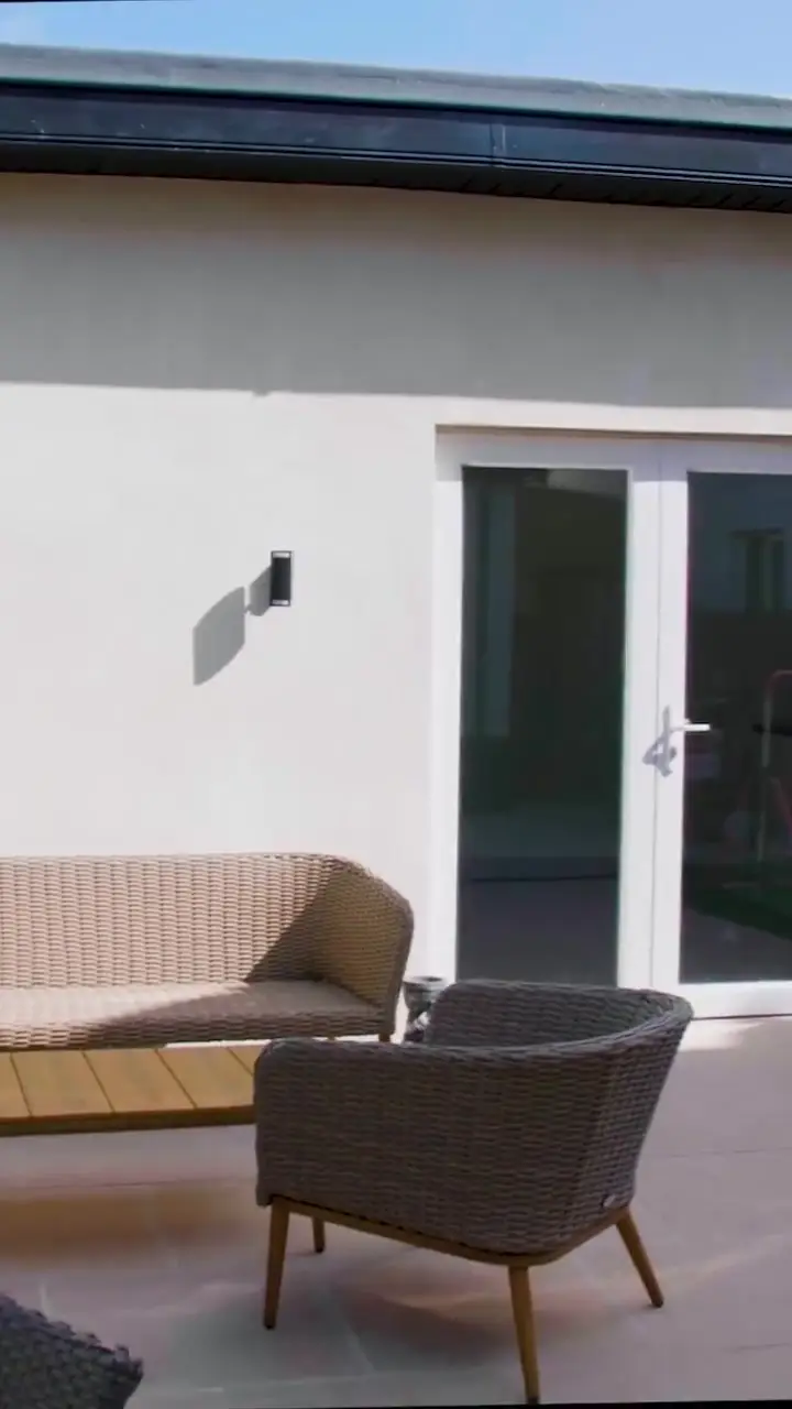 Rendered garden home with French doors and a seating area