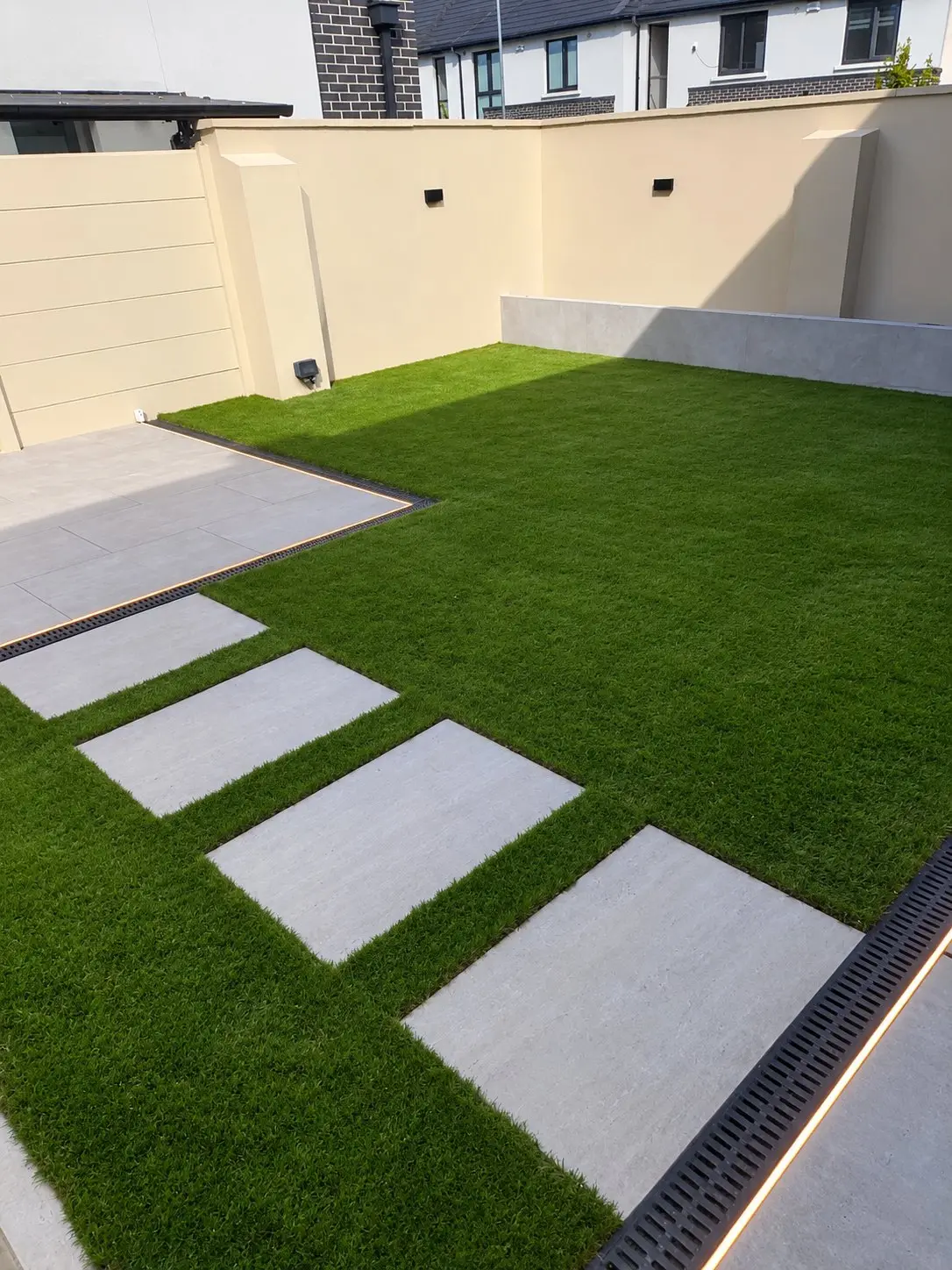 Porcelain patio and stepping stones with lit drainage channels, Tullamore