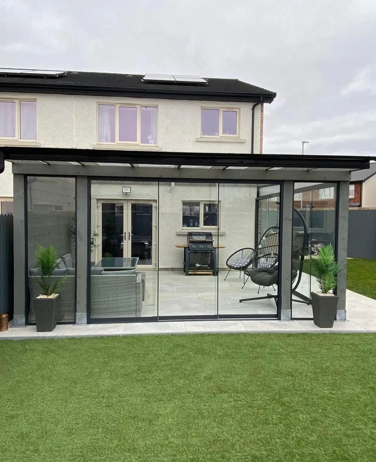 Glass room on the rear of a new house