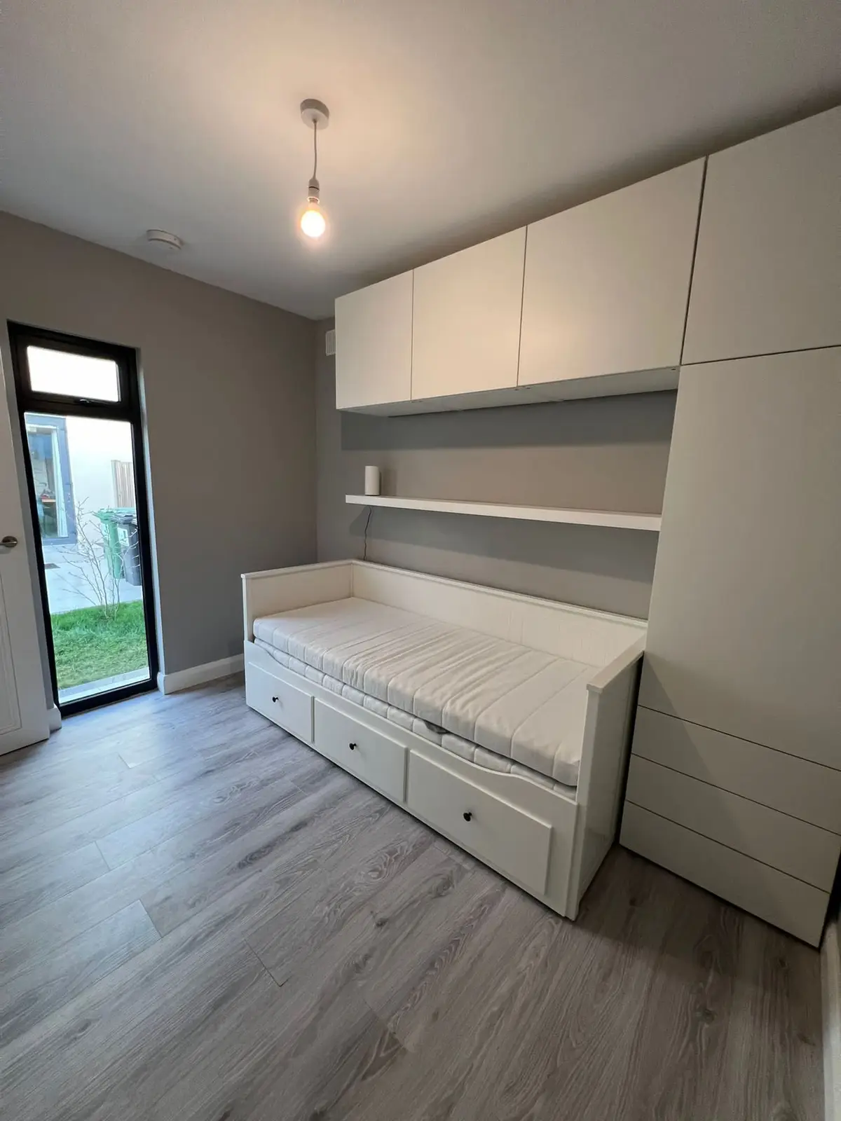 Bedroom with built-in wardrobes and bed
