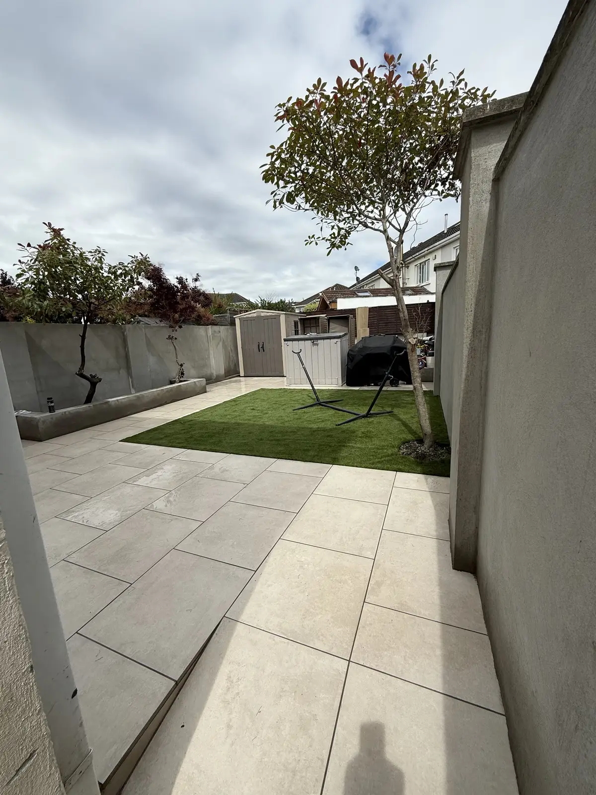 Side and rear porcelain patio with new lawn, Kinsealy