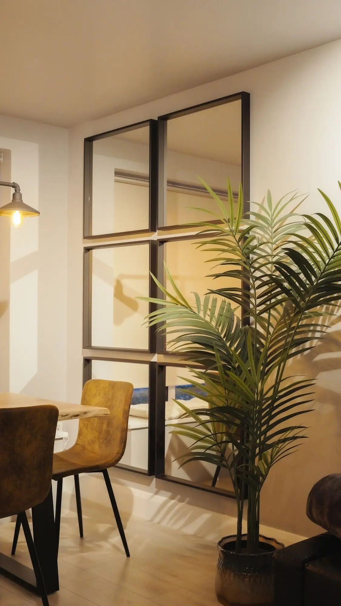 Dining with black-framed glazed partition