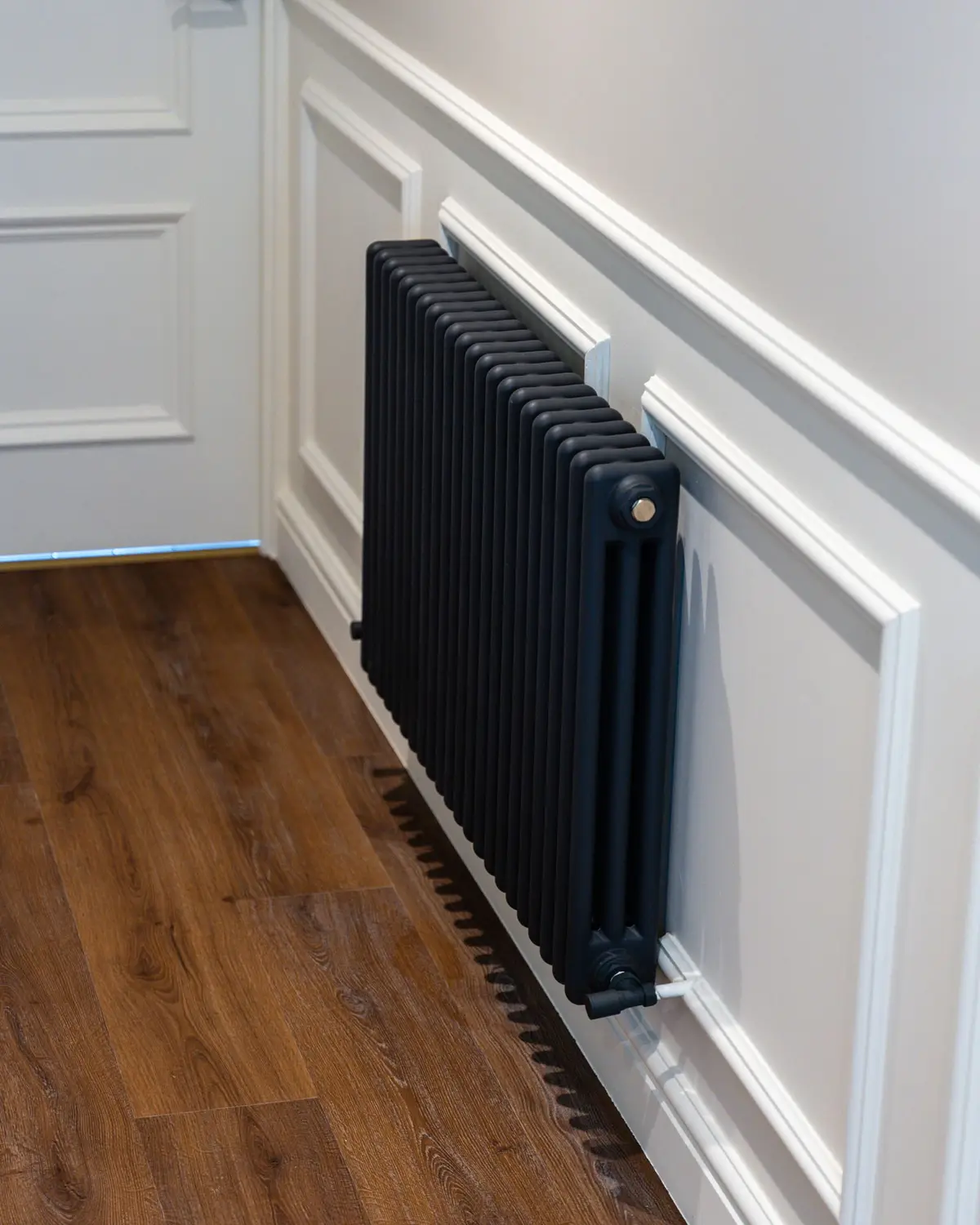 Panelled hall with column radiator