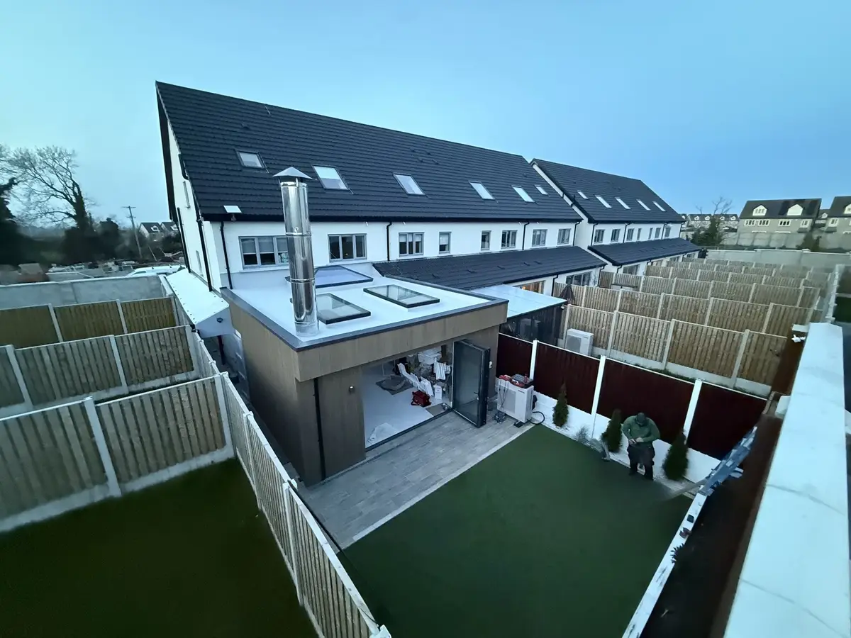 High view of new rear extension, rooflights, landscaped garden