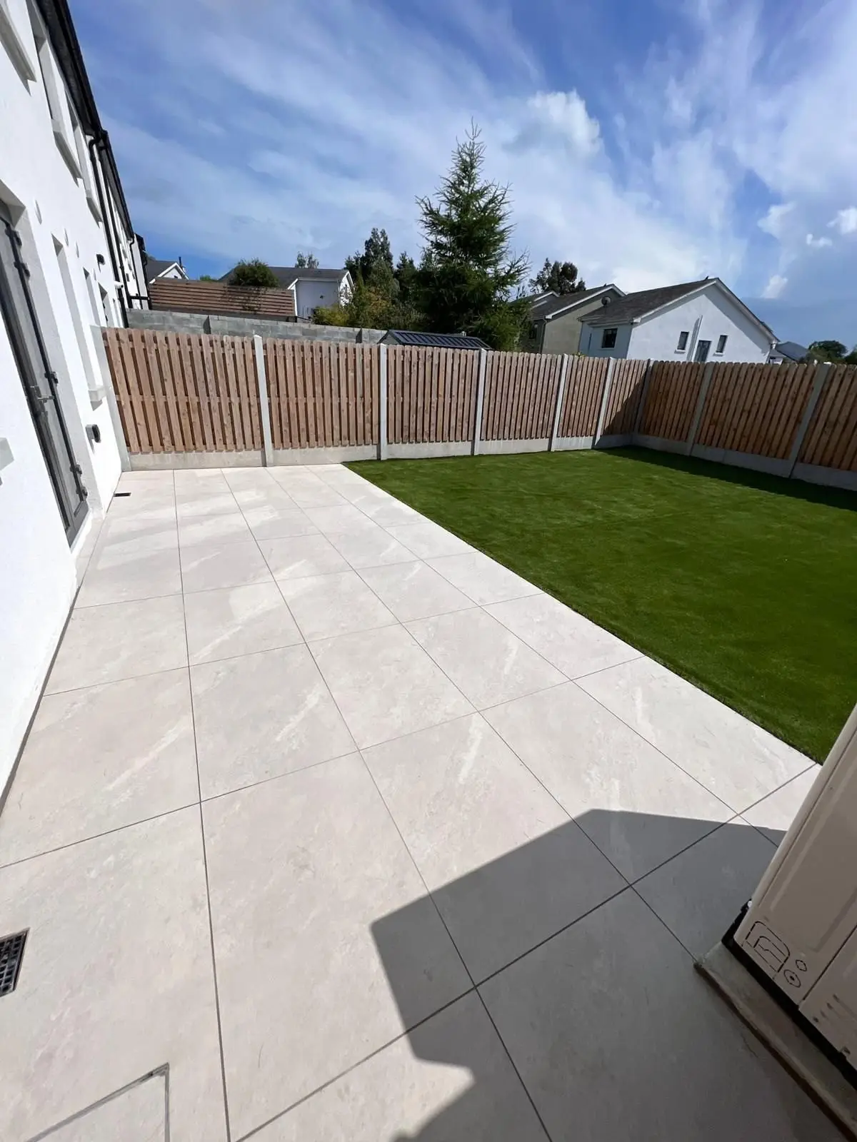 Porcelain patio, lawn and new fencing