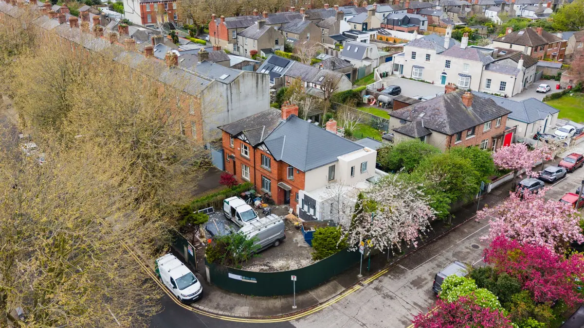 Drone view of the whole site in its street