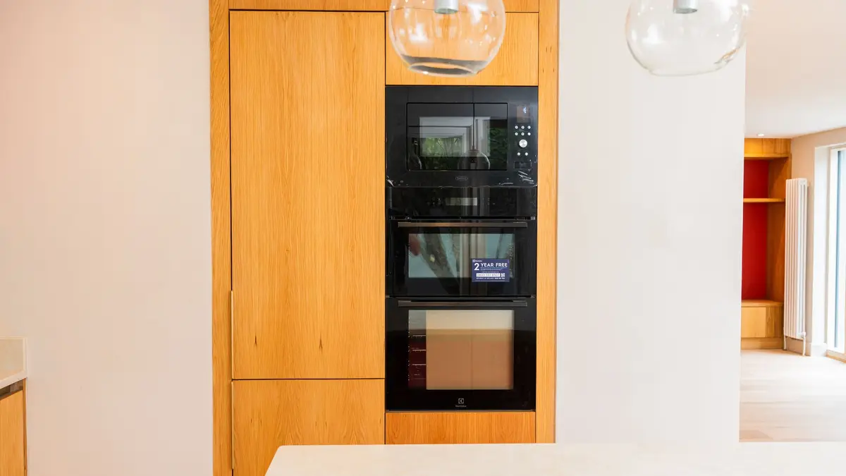 Oak tall units with integrated ovens