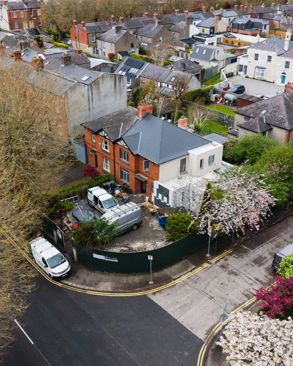 Drone: whole house under renovation, skip, van, extension