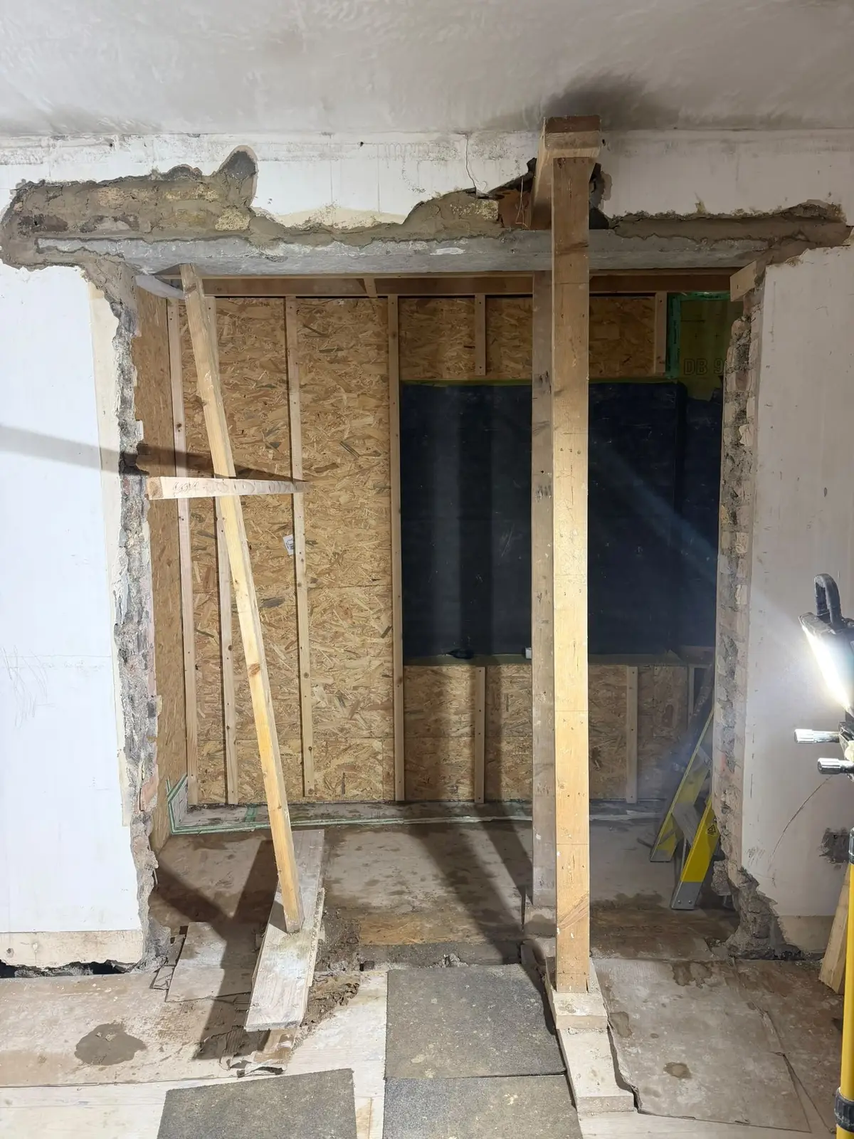 A new opening through an existing wall, with temporary props in place