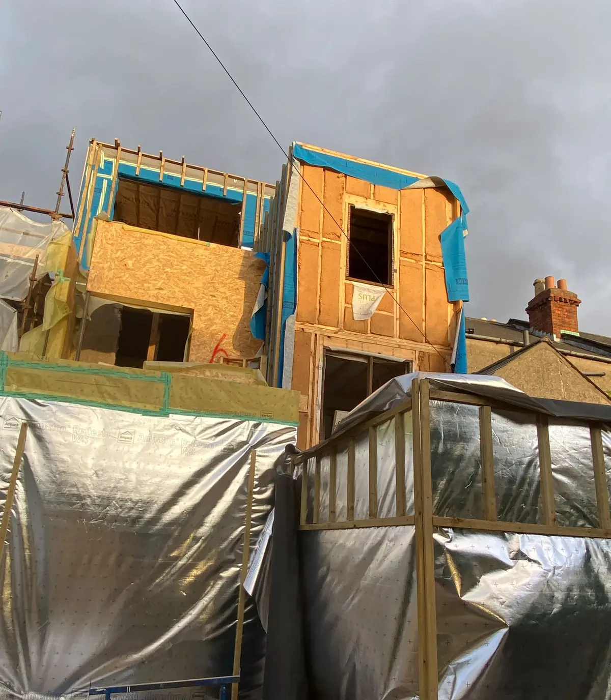 The rear of the house with the new upper floors framed and sheathed