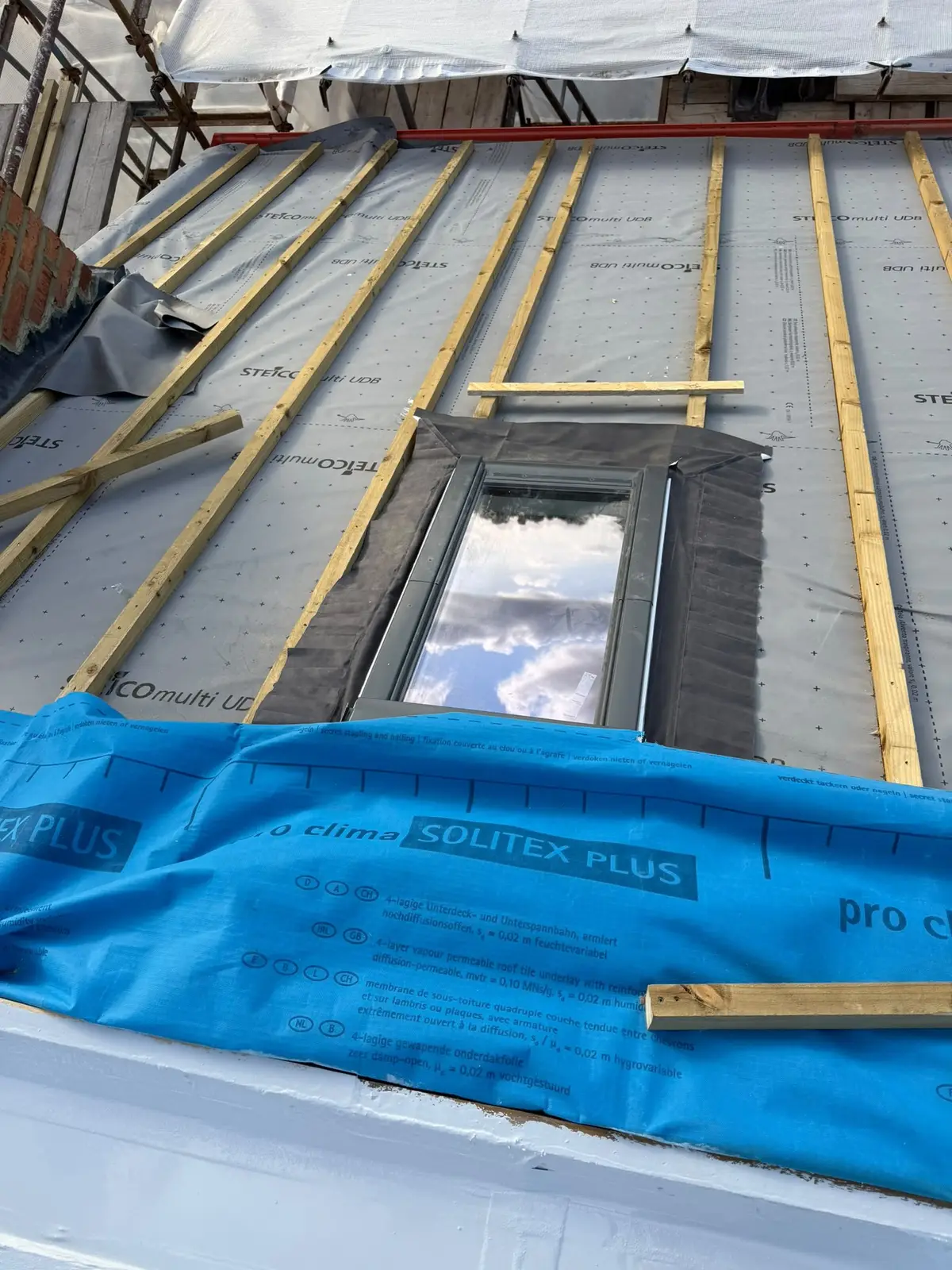 Roof membrane and battens around a new rooflight